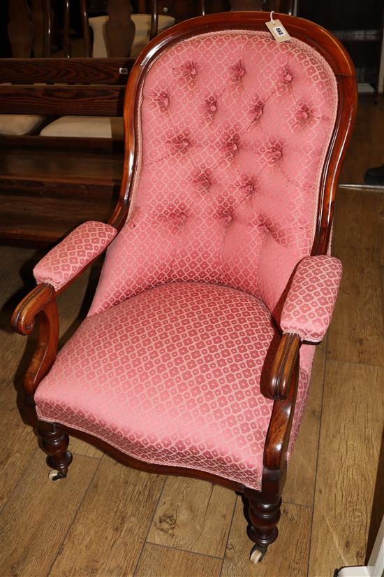 A Victorian spoon-back armchair